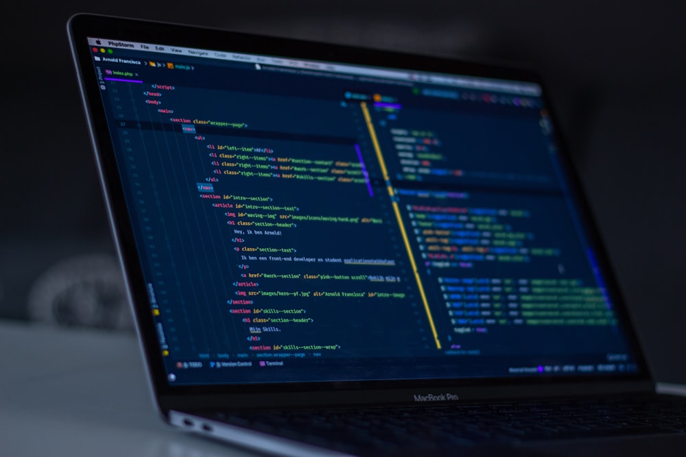 Source code in an editor on a laptop screen